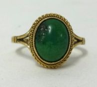 A 9ct green stone cabochon ring, ring size N.