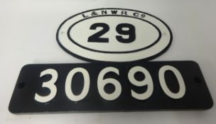A rectangular train number plate 30690, width 56cm, glued together, also an L and NWR Company oval