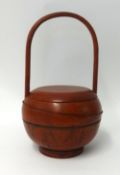 A Chinese red painted wood food carry pot, height 47cm