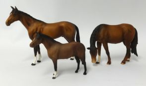 Three matt Beswick horses, tallest 20cm