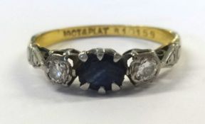 18ct and platinum three stone saphire and diamond ring.