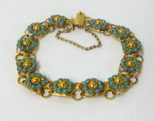 A high carat gold and turquoise flower bracelet, approx 17.6gms.