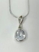 A white gold necklace, approx 4.30gms, set with a single pale topaz stone.