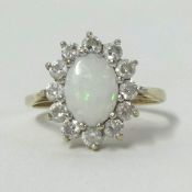 A modern 9ct opal cluster ring, finger size J.