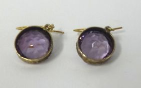 A pair of antique amethyst and gold drop earrings.