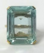 A large aqua marine ring set in yellow gold, approx 32cts, finger size N.