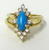 A reversible ring, set with turquoise diamonds and opal, set in yellow gold, finger size O.