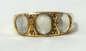 A 18ct triple moonstone ring, finger size P.