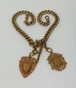 A 9ct gold curb link watch chain, with T-bar and two 9ct gold pendants, approx 57.4gms.