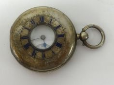 A silver half hunter pocket watch with enamelled front dial, key wind movement, back plate with