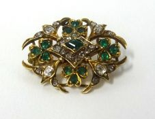 A antique emerald and diamond set brooch in yellow gold, width approx 30mm.