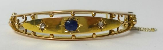 An antique 15ct gold diamond and sapphire set bangle, approx 16.4gms.