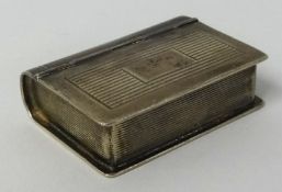 A 20th century silver and gilt lined snuff box in the form of a book, maker 'H.U', approx. 40mm