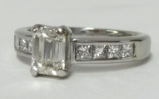 A fine diamond ring set in white gold, the emerald cut centre stone weighing approx 1.50cts, further - Image 2 of 2