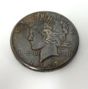 An American 1922 silver dollar.