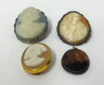 Three vintage cameos and a hardstone pendant (4).