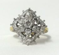 A 18ct diamond set cluster ring, finger size K.