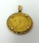 A George V 1911 half sovereign pendant.