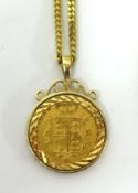 A Victorian gold shield back sovereign, 1863, set in a pendant mount on a fine 9ct gold chain.