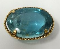 A large aqua marine brooch, approx 80cts, set in yellow gold, approx 35mm x 25mm.