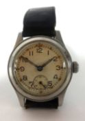 A gents vintage military wristwatch, the back plate stamped ATP43024, set with arabic numerals and