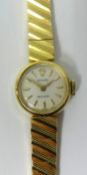 An 18ct ladies Rolex approx 23gms, with original box.