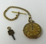 A 14ct gold half hunter pocket watch with keyless key wind movement, with gilt metal guard chain and