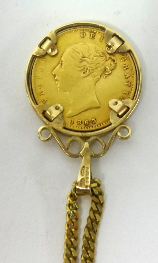 A Victorian gold shield back sovereign, 1863, set in a pendant mount on a fine 9ct gold chain. - Image 2 of 2