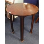 An Arts & Crafts style circular occasional table.