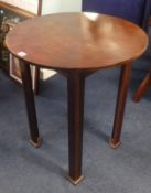 An Arts & Crafts style circular occasional table.