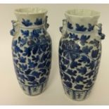 A pair of blue and white oriental porcelain vases, height 25cm.