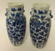 A pair of blue and white oriental porcelain vases, height 25cm.