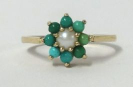 A 9ct turquoise and pearl cluster ring, finger size M.