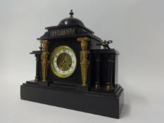 A Victorian slate cased mantle clock.