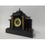 A Victorian slate cased mantle clock.
