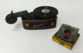 A Bing Bingola (German) toy gramophone with tinplate case and pick-up arm, wind up motor.