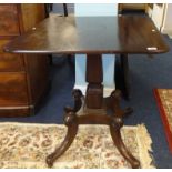 A 19th century mahogany centre table on a pedestal base.