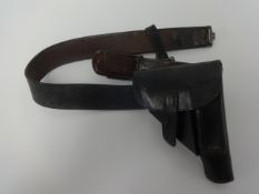 A German WWII military belt, the buckle stamped 'Gott Mit Uns' with pistol holster.