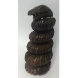 A carved wood coiled snake, height 51cm