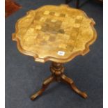 A 19th century mahogany tripod games table.