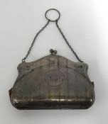 An antique silver purse.