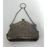 An antique silver purse.