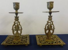 A pair of Victorian William Townshend aesthetic period gilt brass candlesticks