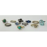 A collection of 11 gold and other dress rings.