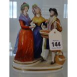 A German porcelain three figure group.