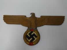 A 20th century cast alloy plaque, modelled as a WWII German Third Reich Nazi wall plaque in the form