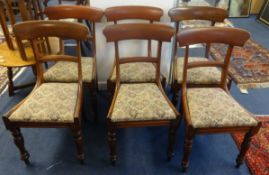 A Victorian mahogany dining table and a matched set of six 19th century mahogany framed dining