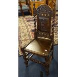 A Victorian carved oak side chair, with carved panel inscribed '1691'.