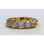 An Antique 18ct five stone diamond ring set with old cut diamonds, ring size P.