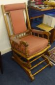 An Edwardian rocking chair.